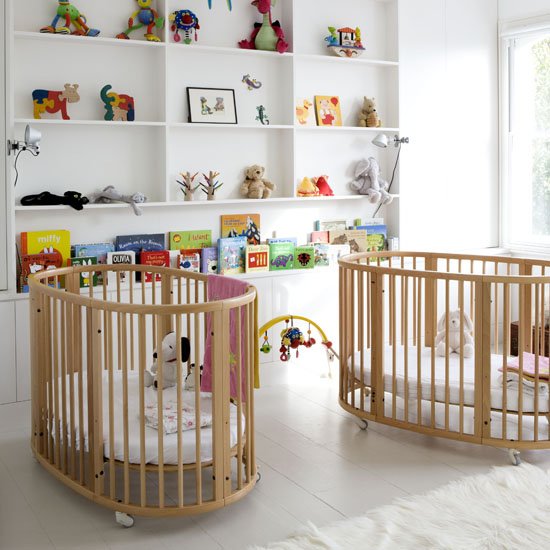 White twins nursery with twin cots built in wall shelves painted floorboards real home L etc 02/2009 pub orig