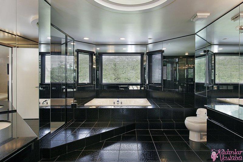 Master bath in luxury home with black step up bath