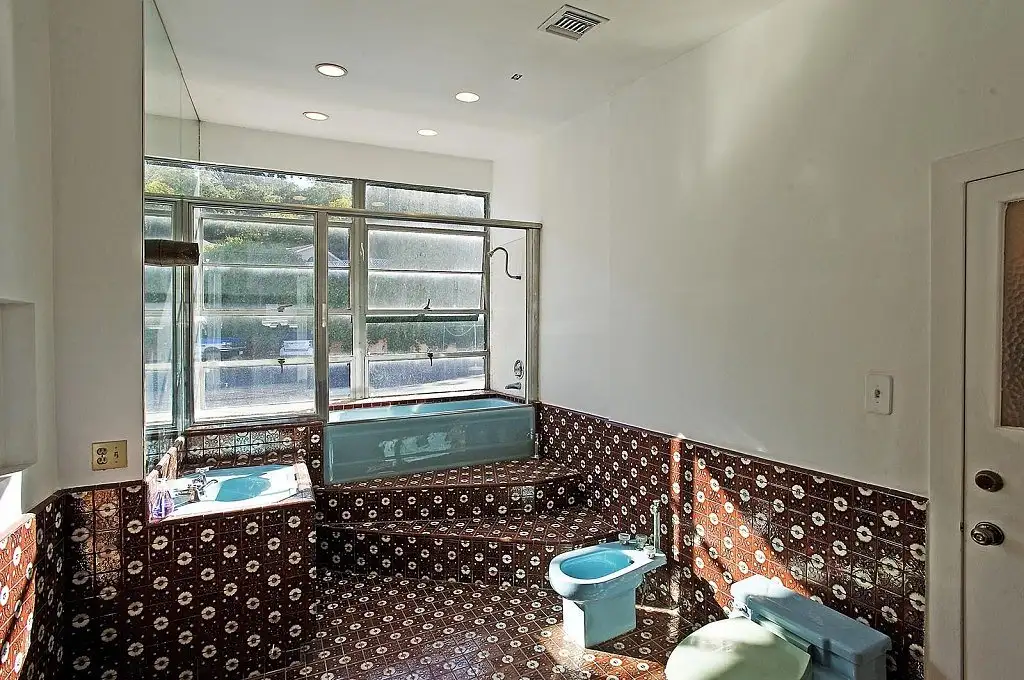 Another-bathroom-filled-bold-patterned-tiling.webp