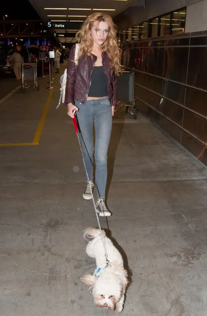 bella-thorne-lax-airport-departure-candids-in-los-angeles-may-21-2014_4.webp