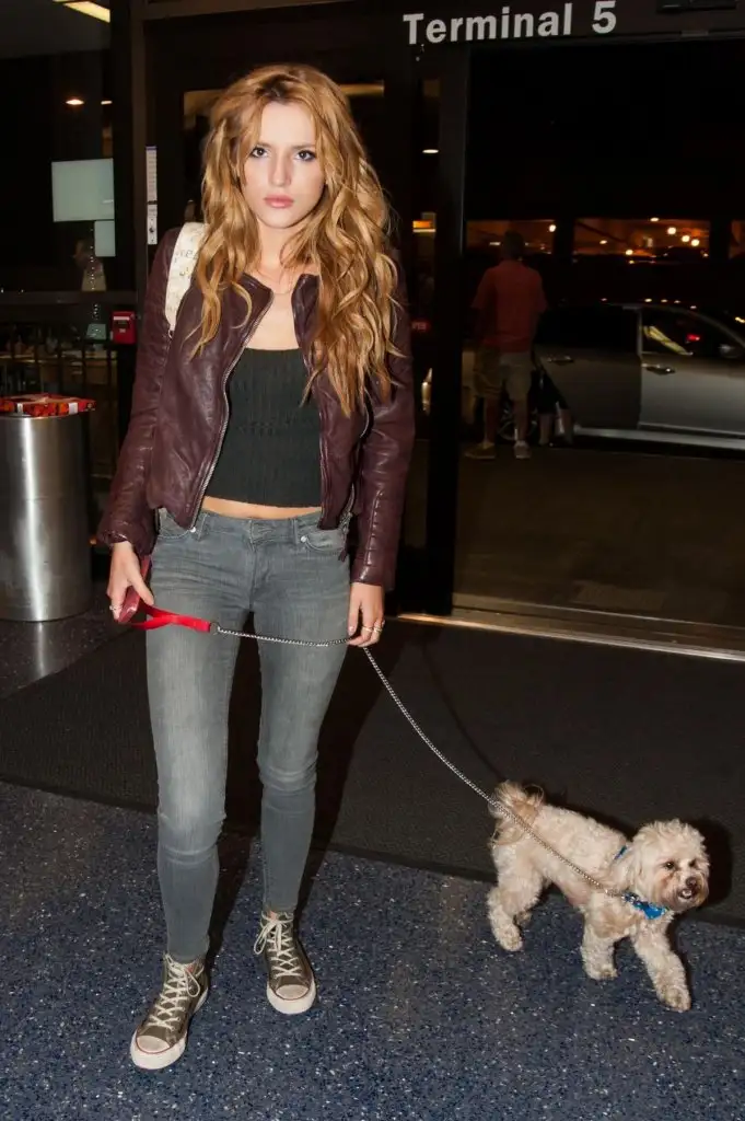 bella-thorne-lax-airport-departure-candids-in-los-angeles-may-21-2014_7.webp