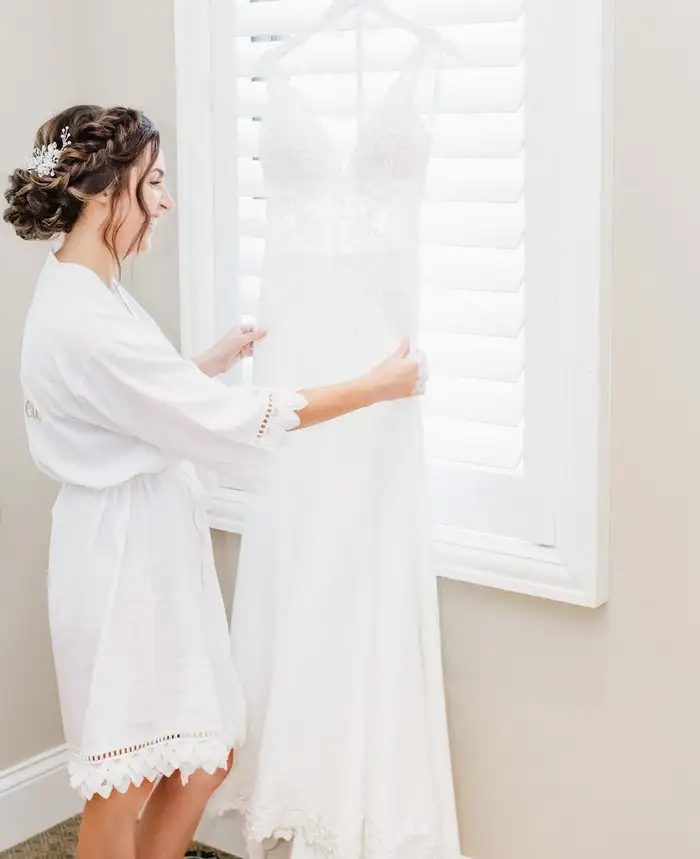 Bride-getting-ready-for-the-wedding-with-bridal-robe.webp