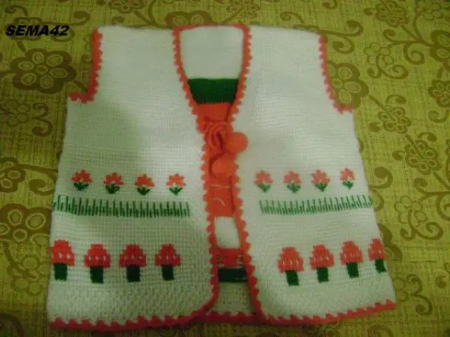 cicekli-beyaz-tunus-isi-bebek-yelegi.webp