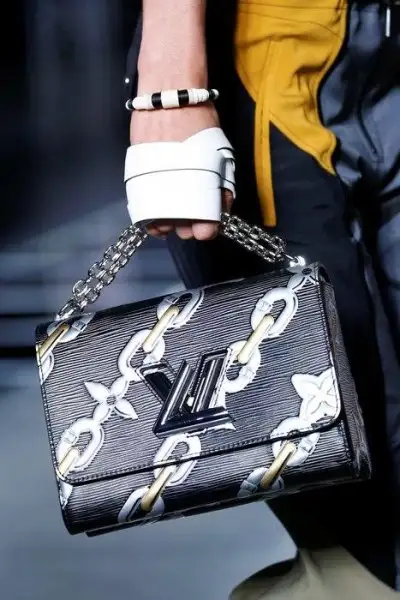 Louis_Vuitton_BlackSilver_Epi_Chain_Print_Twist_Bag_Spring_2016.webp