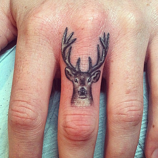 small-deer-tattoo-on-finger.png