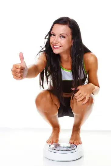 woman-with-scales-after-a-successful-diet.webp