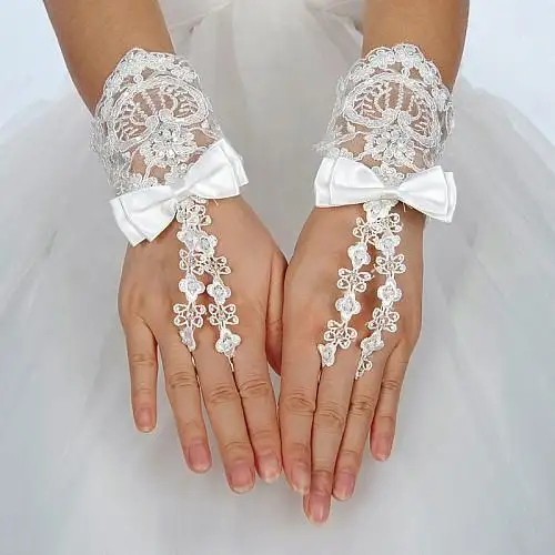 Wristlength_Fingerless_Ivory_Lace_Wedding_Gloves_with_Satin_Bow.webp