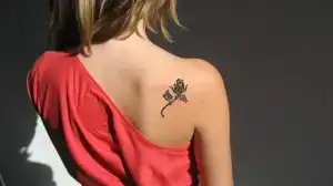 $black-rose-tattoo-on-the-back-300x168.webp