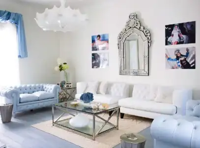 $modern-chic-blue-and-white-living-room-with-chandelier.webp