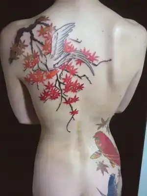 $cherry-blossom-tattoo-back-girl3.webp