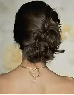 $Romantic_bridal_wedding_updo_with_light_curls.webp