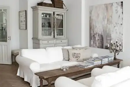 $white-slip-covered-sofa-country-flea-market-style-decorating-vintage-gray-weathered-coffee-t...webp
