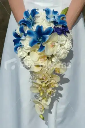 $cherie_blue_trumpet_lily_wedding_bouquet.webp