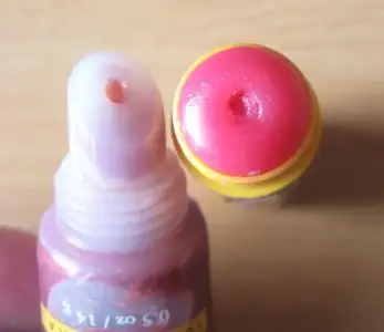 $Burts-Bees-Super-Shiny-Lip-Gloss-in-Zesty-Red-and-Lip-Balm-in-Pomegranate.webp