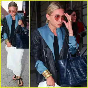 $ashley-olsen-adjusting-sunglasses.webp