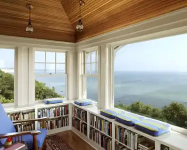 $amazing-cat-library-bookcase-plans-with-bay-window-and-even-window-seats-in-front-of-beach-v...webp