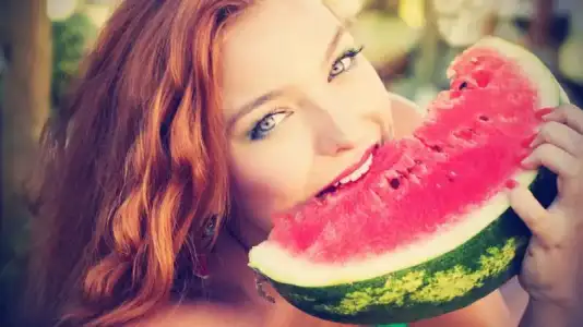 $Beautiful-Woman-with-Makeup-Eating-watermelon.webp